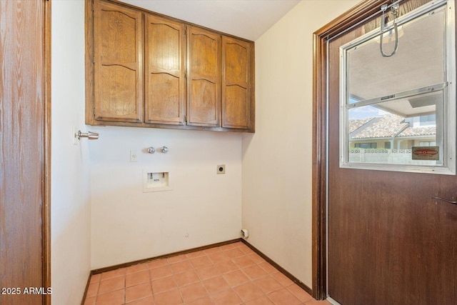 washroom featuring baseboards, electric dryer hookup, cabinet space, light tile patterned floors, and washer hookup