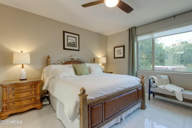 bedroom featuring a ceiling fan and marble finish floor