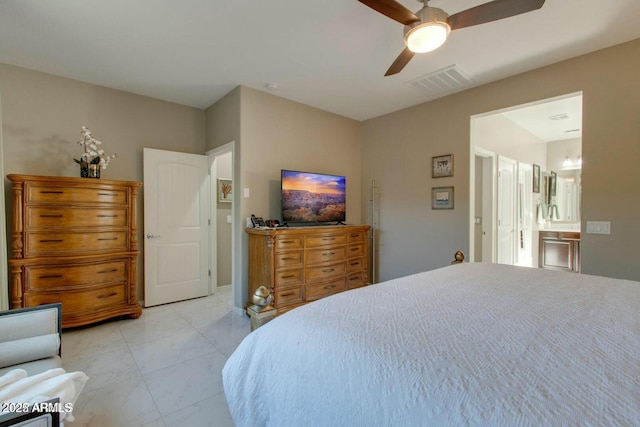 bedroom with ensuite bath, visible vents, marble finish floor, and ceiling fan