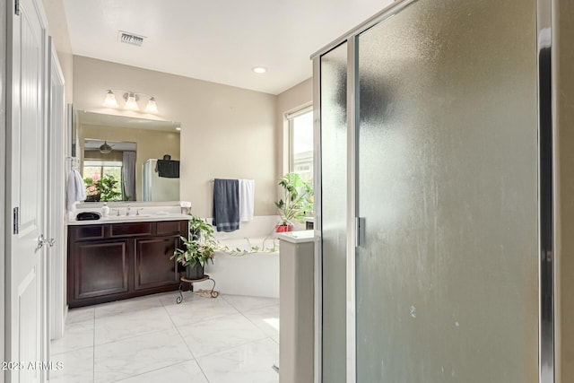 bathroom with vanity, visible vents, marble finish floor, and a stall shower