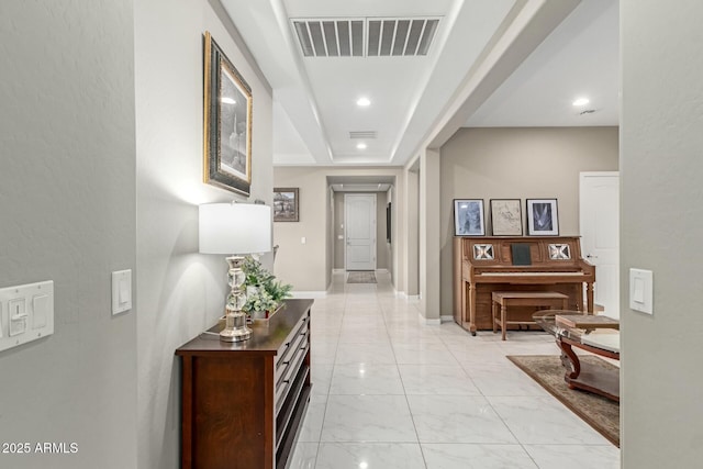 hall featuring recessed lighting, visible vents, baseboards, and marble finish floor