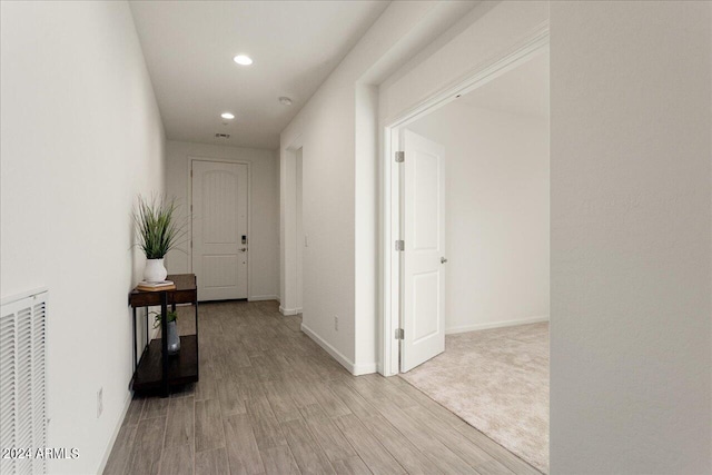 hallway featuring light hardwood / wood-style flooring