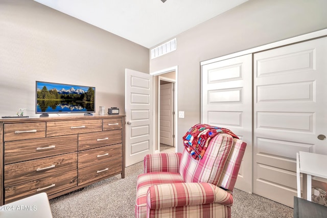 sitting room featuring light colored carpet