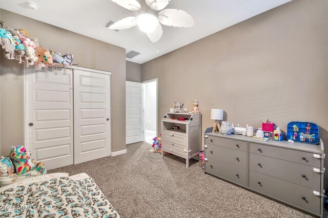 bedroom with ceiling fan, a closet, and carpet