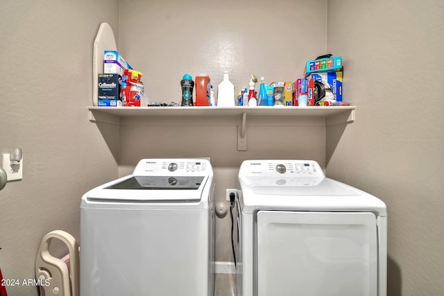 laundry area with independent washer and dryer