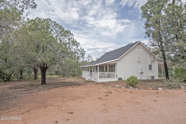 view of side of home featuring a porch