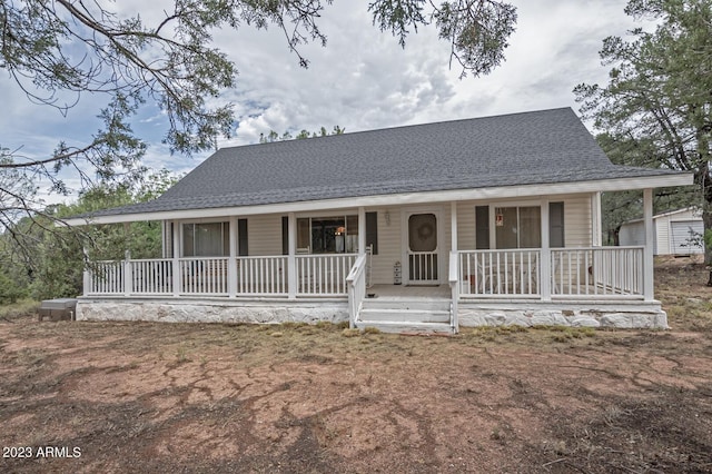 farmhouse inspired home featuring covered porch