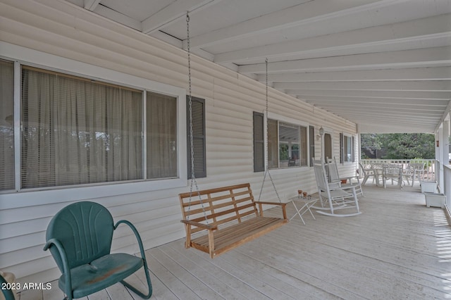 wooden deck featuring covered porch