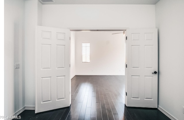 interior space with dark hardwood / wood-style flooring