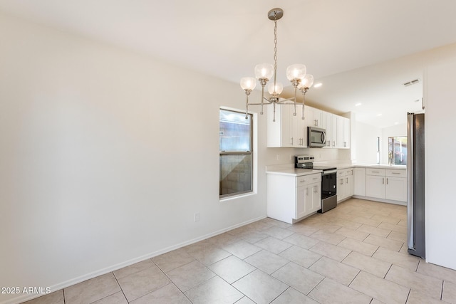 kitchen with hanging light fixtures, light tile patterned floors, a notable chandelier, stainless steel appliances, and white cabinets