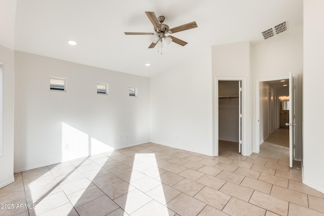 tiled empty room featuring ceiling fan