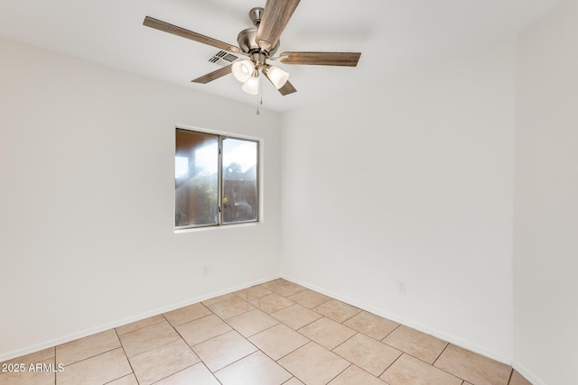 spare room with light tile patterned flooring and ceiling fan