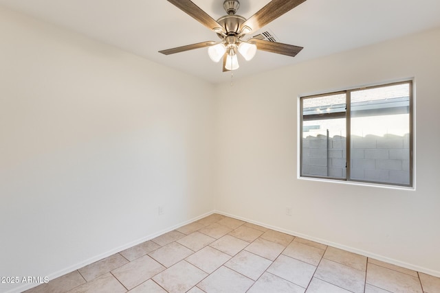 spare room with light tile patterned floors and ceiling fan