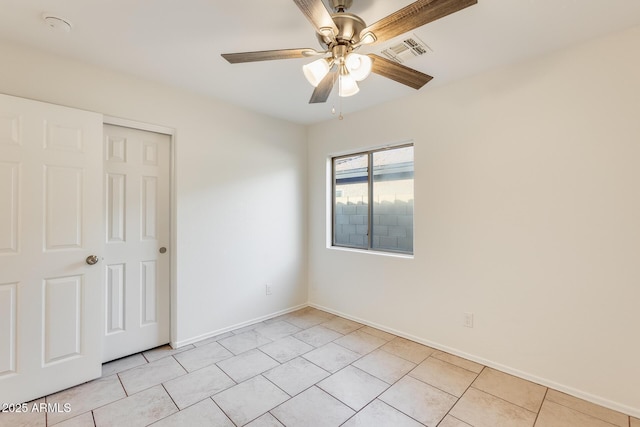 unfurnished bedroom with ceiling fan, a closet, and light tile patterned floors