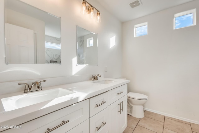 bathroom with vanity, tile patterned floors, and toilet