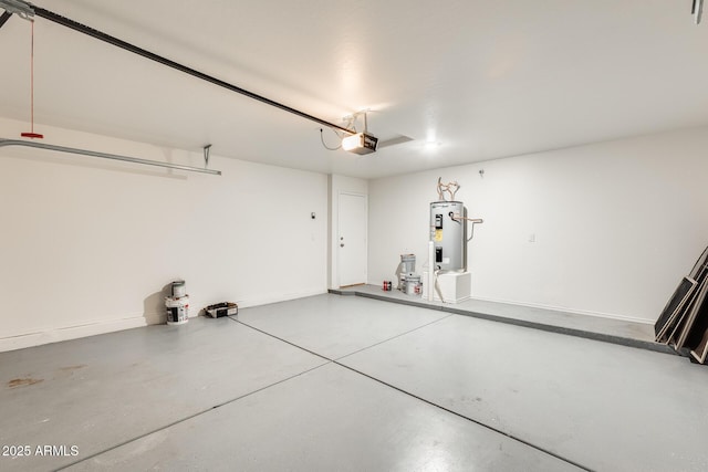 garage featuring a garage door opener and electric water heater