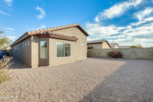 rear view of property featuring a patio area