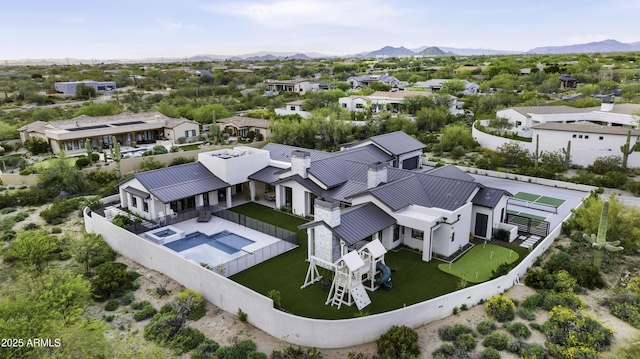 birds eye view of property featuring a mountain view