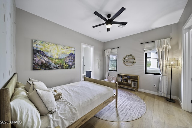 bedroom with light hardwood / wood-style floors and ceiling fan