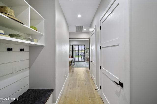 hall with light hardwood / wood-style flooring