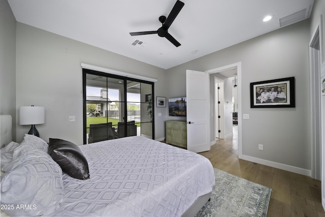 bedroom featuring ceiling fan, access to exterior, and light hardwood / wood-style floors