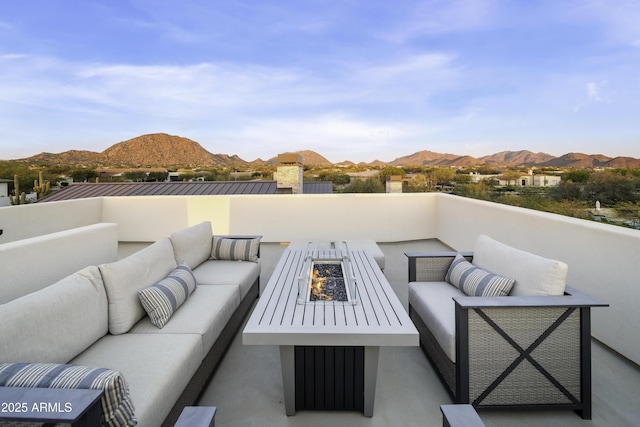 view of patio with a mountain view and outdoor lounge area