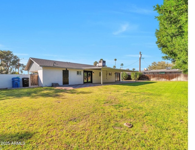 6805 N 12th St, Phoenix, AZ 85014 - back of property with a yard, a patio area, fence, and french doors