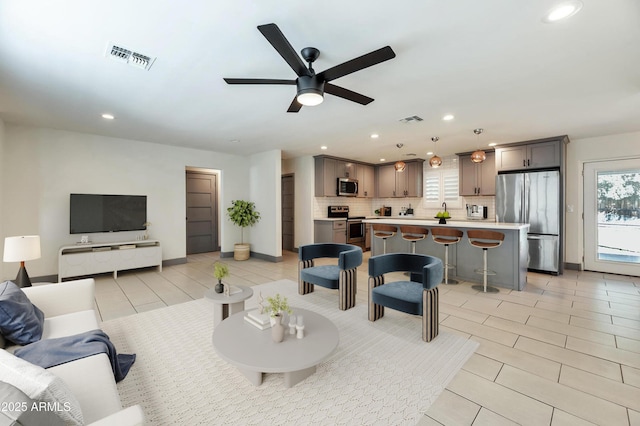 6805 N 12th St, Phoenix, AZ 85014 - living area with recessed lighting, visible vents, and a ceiling fan