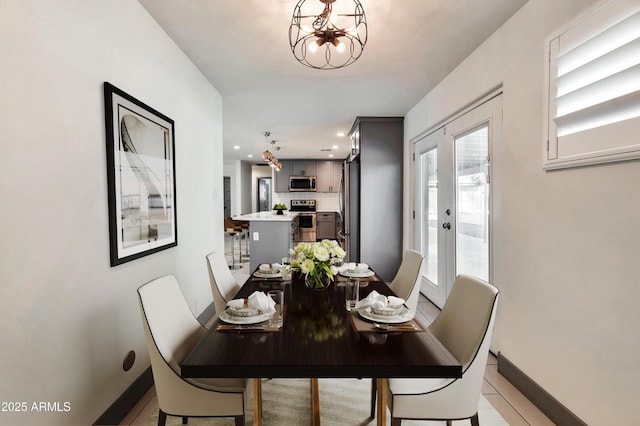 6805 N 12th St, Phoenix, AZ 85014 - dining area featuring an inviting chandelier, baseboards, and recessed lighting