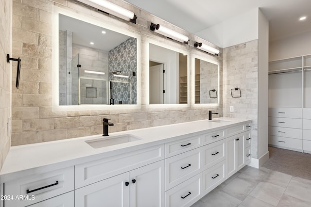 bathroom with vanity, decorative backsplash, walk in shower, and tile patterned flooring