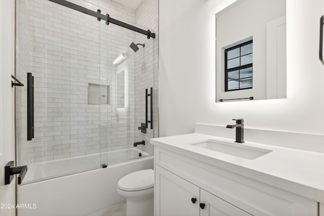 full bathroom featuring shower / bath combination with glass door, vanity, and toilet