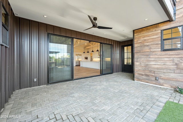 view of patio featuring ceiling fan