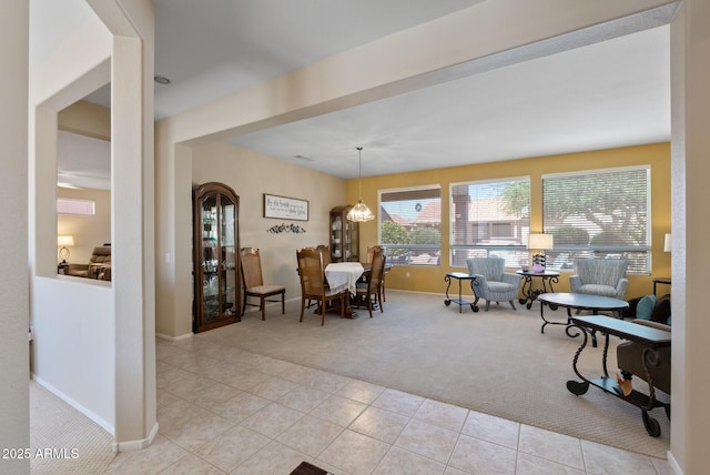 20394 N Coronado Way, Surprise, AZ 85374 - dining room with light colored carpet, light tile patterned floors, and a chandelier