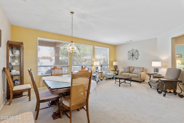 20394 N Coronado Way, Surprise, AZ 85374 - dining area with light carpet and a chandelier