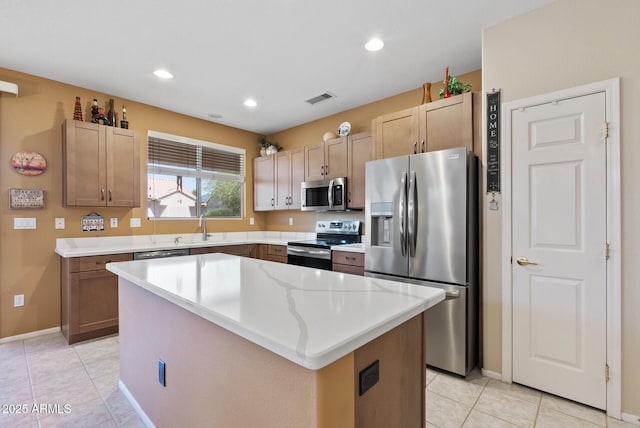 20394 N Coronado Way, Surprise, AZ 85374 - kitchen featuring stainless steel appliances, a kitchen island, light tile patterned floors, recessed lighting, and light countertops