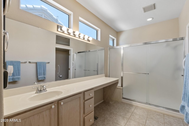 20394 N Coronado Way, Surprise, AZ 85374 - bathroom with a shower stall, vanity, and tile patterned floors