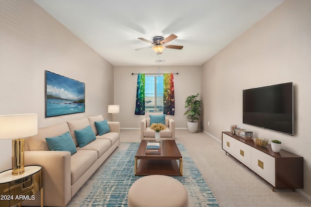 living room featuring light carpet and ceiling fan