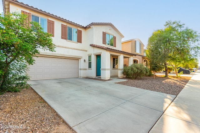 mediterranean / spanish-style home featuring a garage