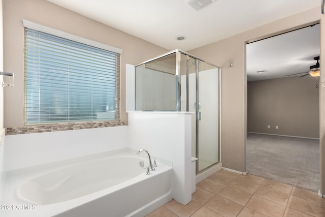 bathroom featuring ceiling fan, shower with separate bathtub, and tile patterned floors