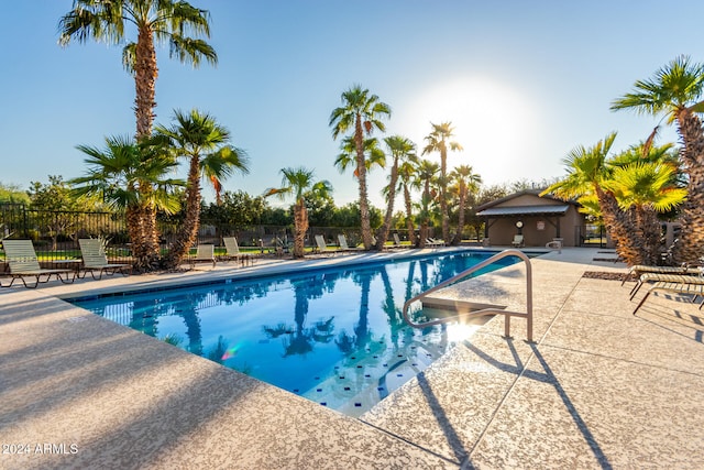 view of swimming pool with a patio area