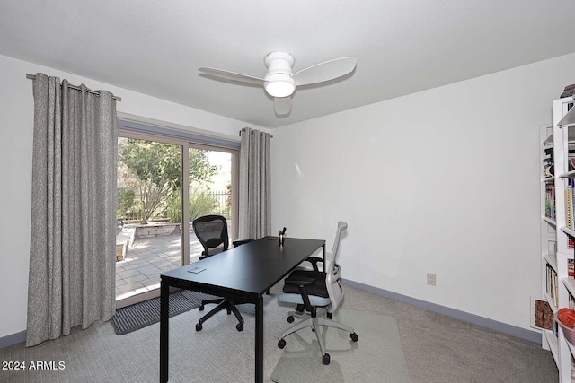 office area with ceiling fan and light colored carpet