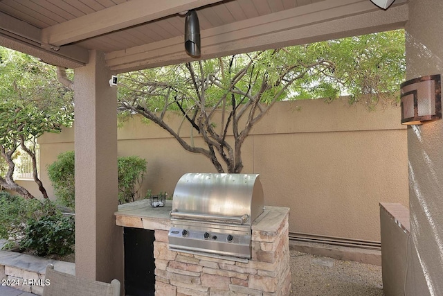 view of patio featuring a grill and an outdoor kitchen