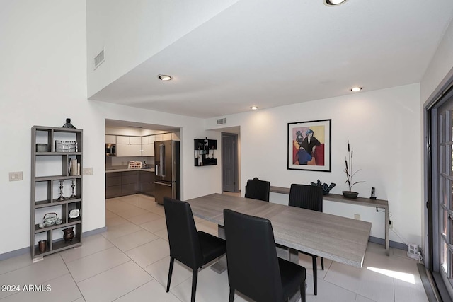 dining space featuring light tile patterned floors