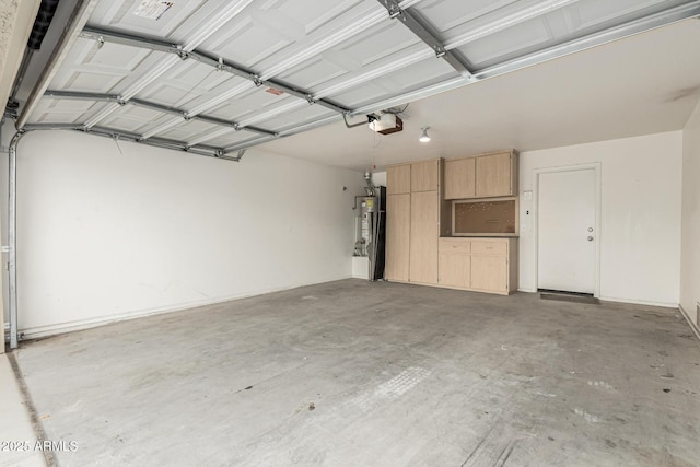 garage with a garage door opener and water heater