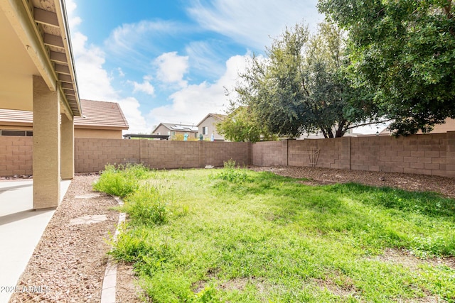 view of yard with a fenced backyard