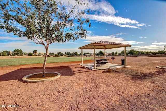 exterior space with a gazebo and a lawn