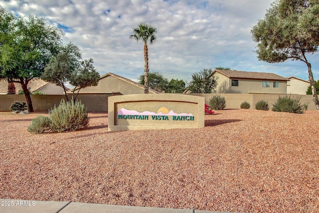 community sign featuring fence