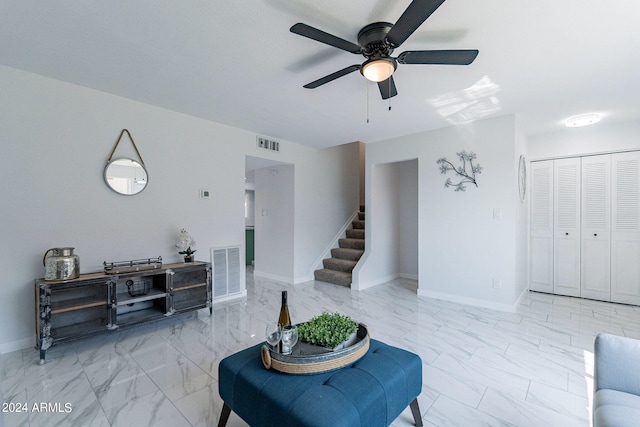 living room featuring ceiling fan