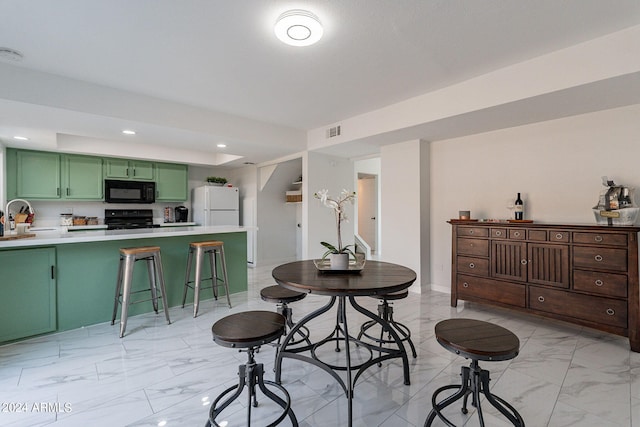 dining space with sink