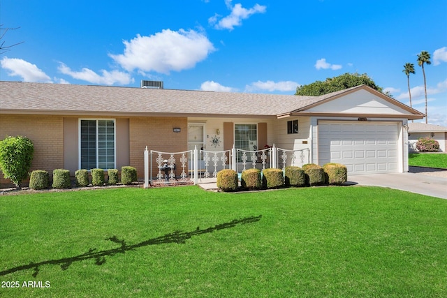 single story home with an attached garage, driveway, a front lawn, and brick siding